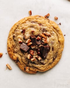 chocolate chip pecan cookie on parchment paper.