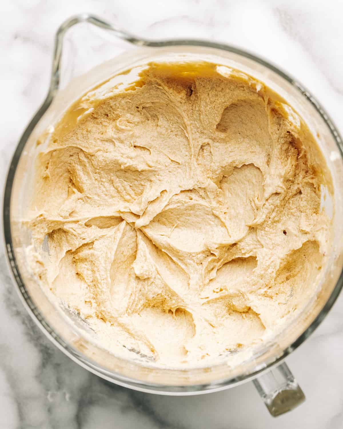 creamed butter and sugar with eggs in a mixing bowl.