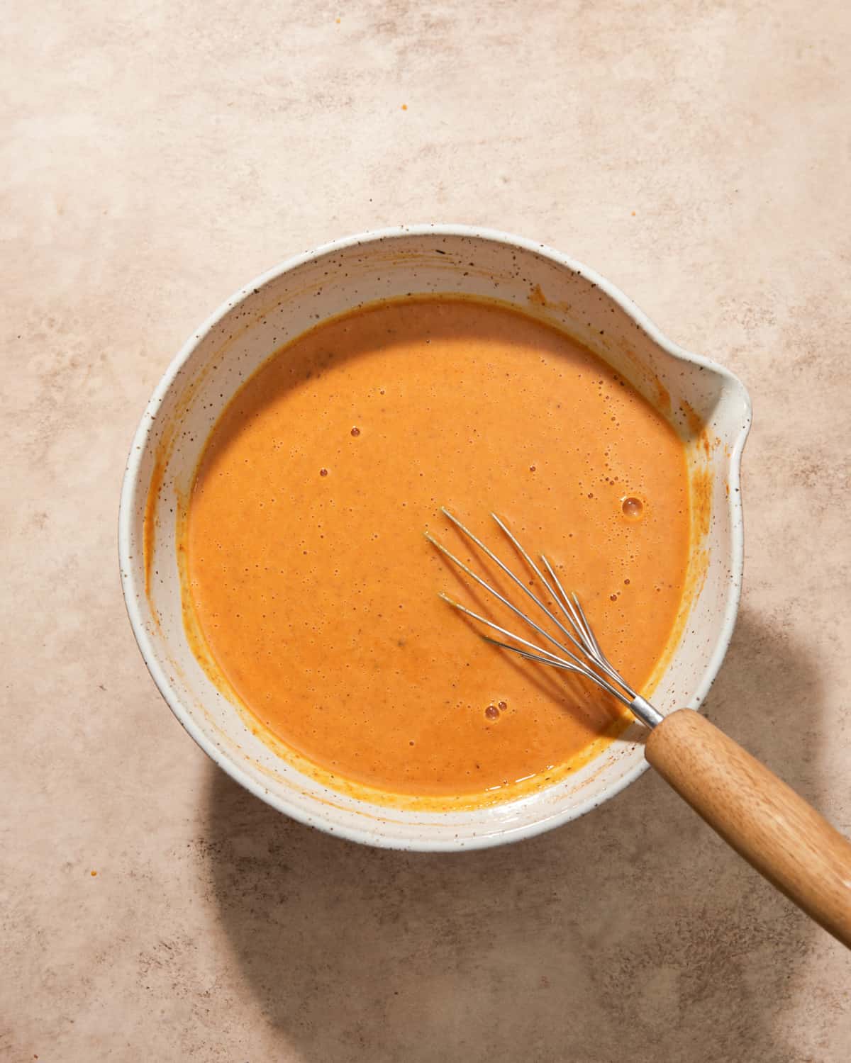 pumpkin pie filling in a mixing bowl.