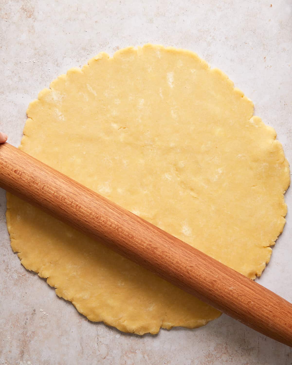 rolled out pie crust with a rolling pin.