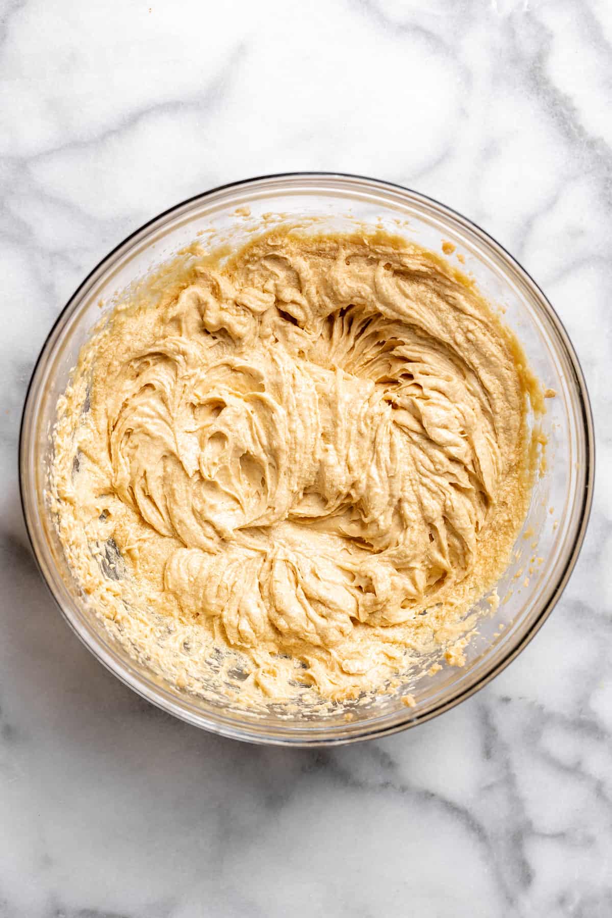 creamed butter with brown sugar and eggs in a mixing bowl.