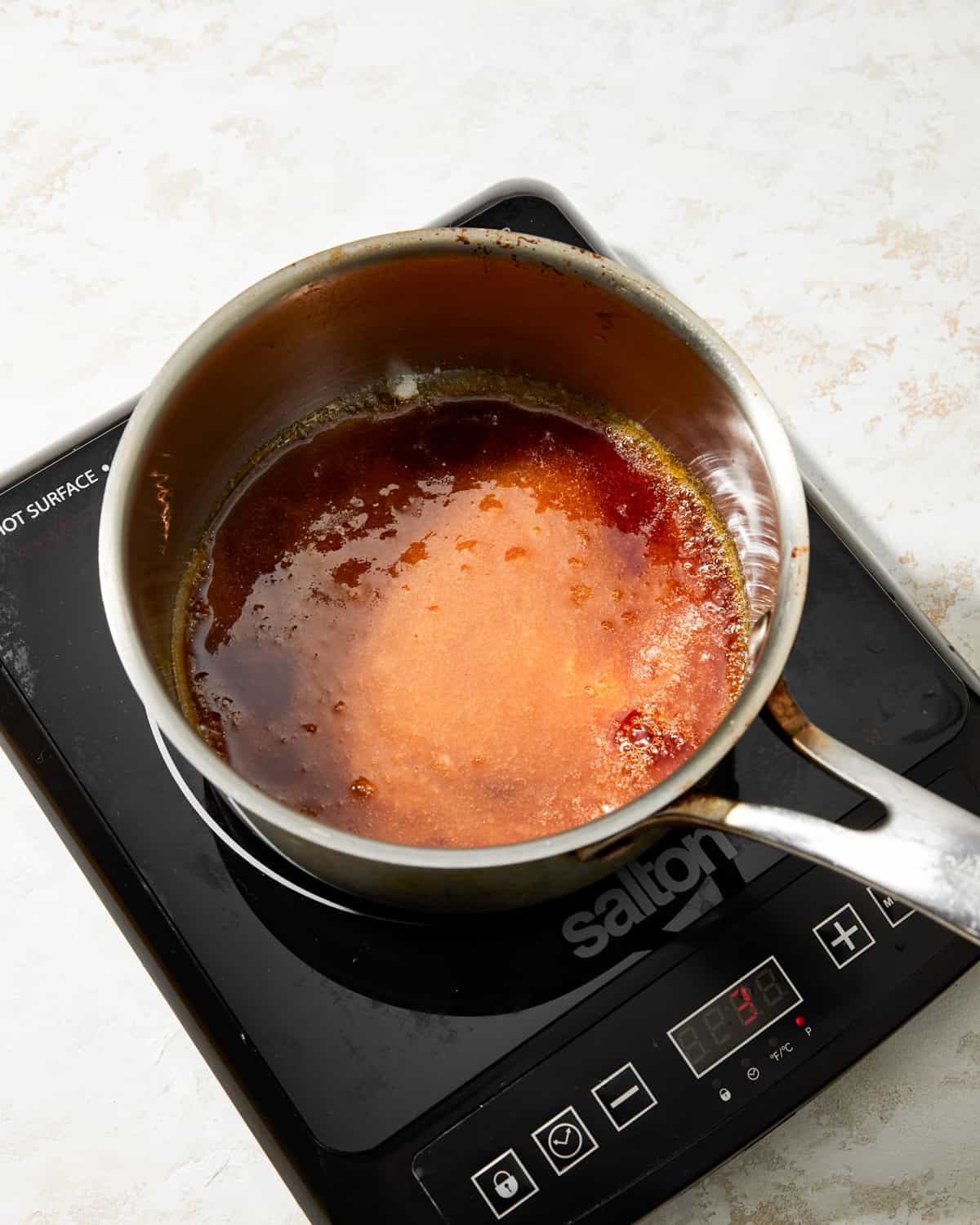 caramel in a saucepan on a hot plate.