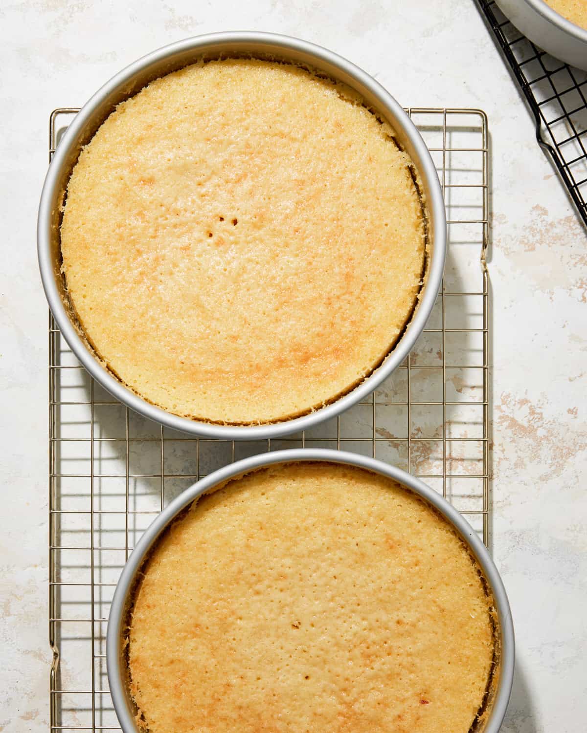 Once baked, allow the cakes to cool in the pans for 10 minutes before transferring them to a wire rack to cool completely.
