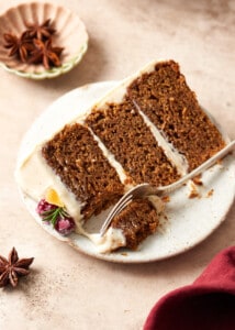 slice of gingerbread cake with cream cheese frosting.