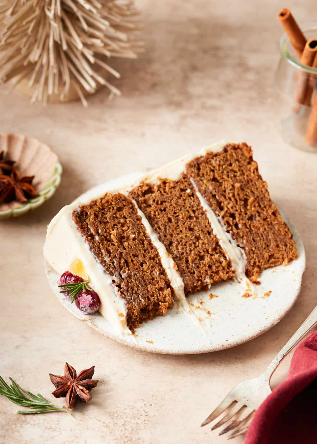 slice of gingerbread cake with cream cheese frosting.