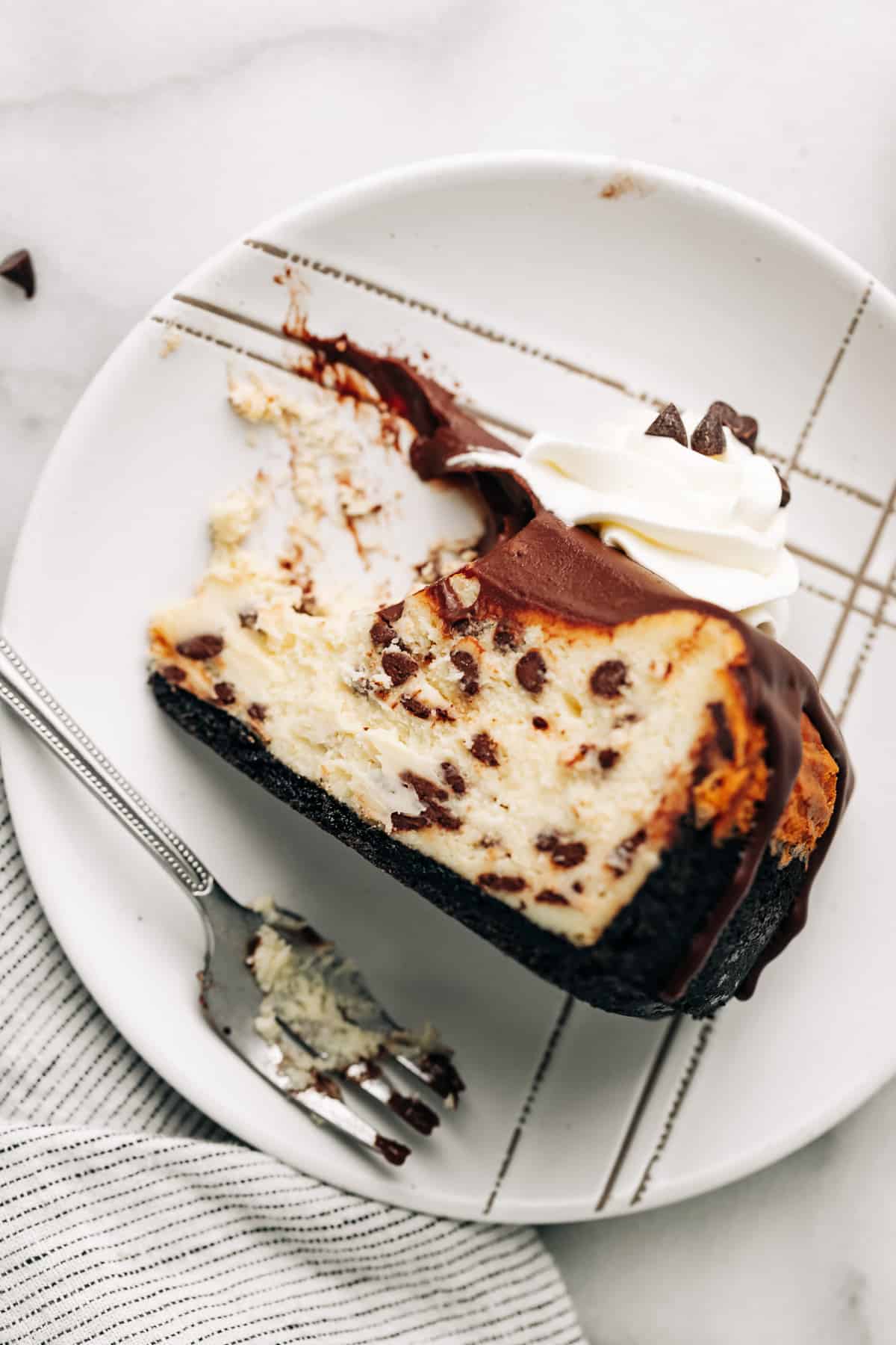 top down view of a slice of chocolate chip cheesecake.