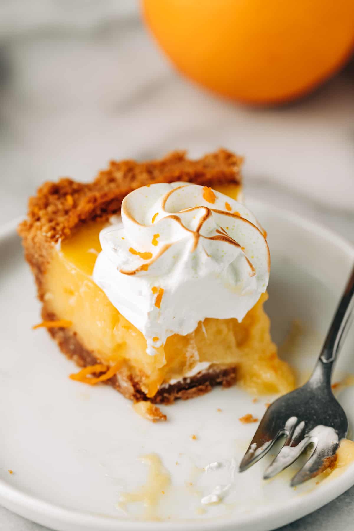 slice of orange pie on a plate.