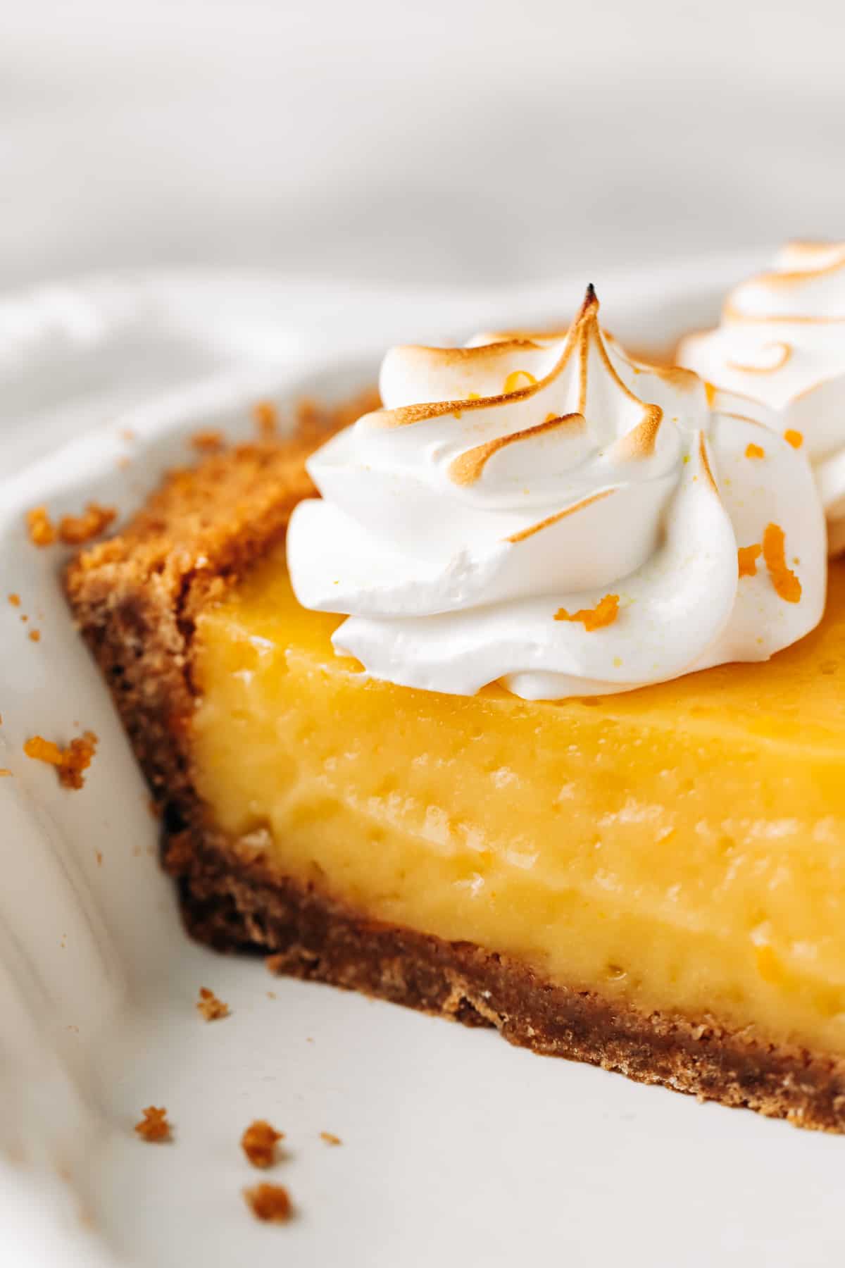 slice of orange pie in a pie dish.