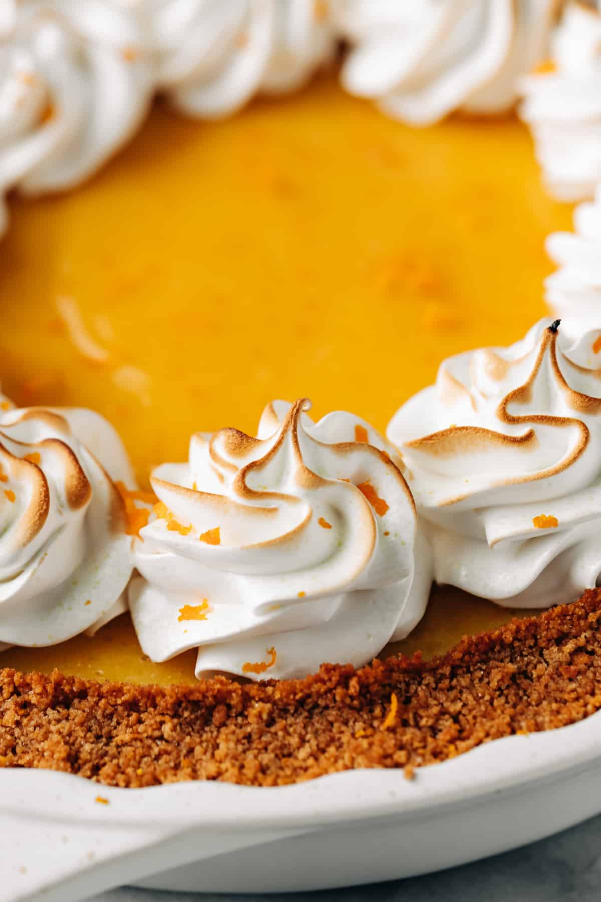 meringue topping on an orange pie