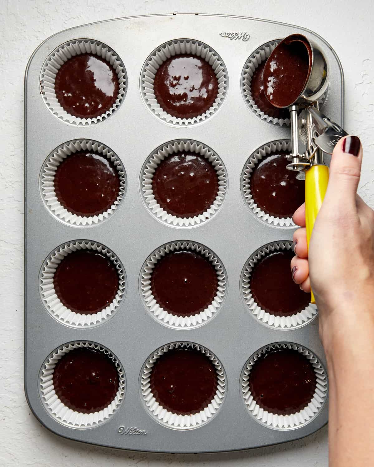 mocha cupcake batter in a cupcake pan.