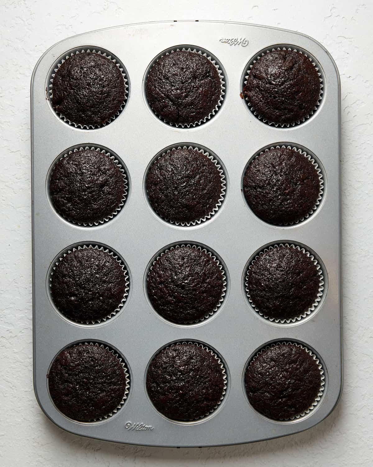 chocolate mocha cupcakes in a cupcake pan.